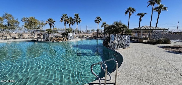 view of swimming pool featuring a gazebo and a patio area