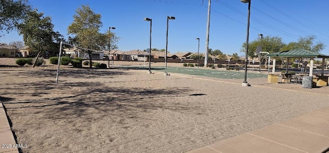 view of property's community featuring a gazebo and basketball hoop