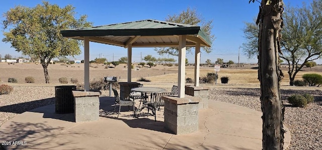 view of patio featuring a gazebo and a rural view