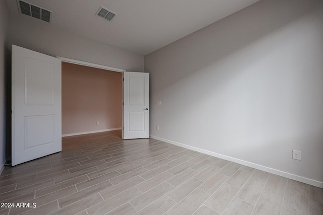 unfurnished bedroom with light wood-type flooring