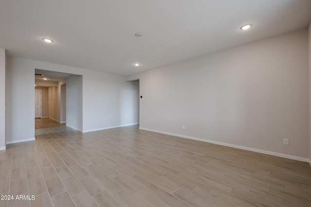 spare room with light hardwood / wood-style floors