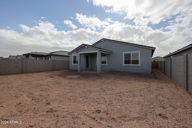 rear view of house featuring a patio area