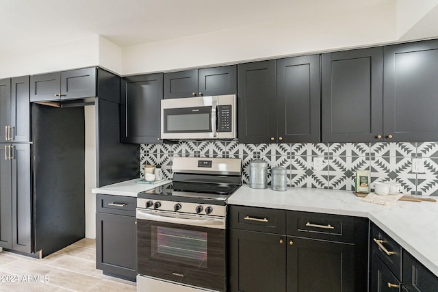 kitchen featuring backsplash and stainless steel appliances