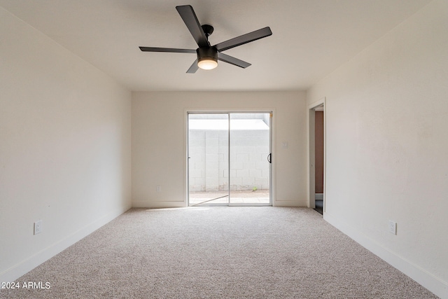 spare room with baseboards, a ceiling fan, and carpet flooring