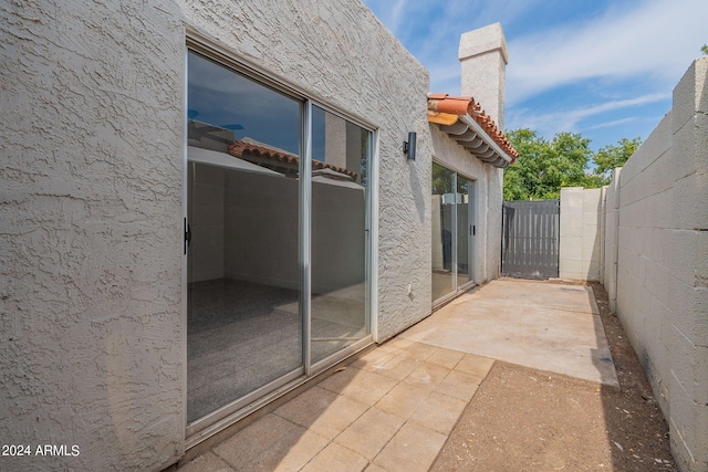 view of patio featuring fence