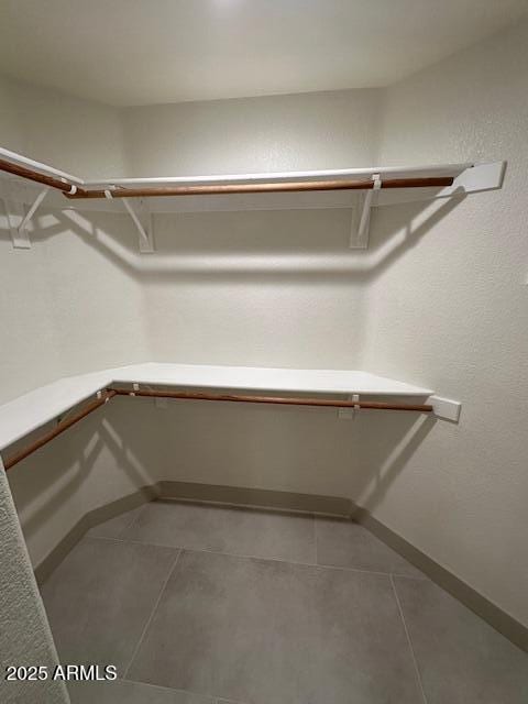 walk in closet featuring tile patterned floors