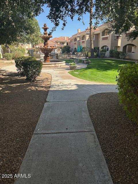 view of community featuring a residential view and a lawn