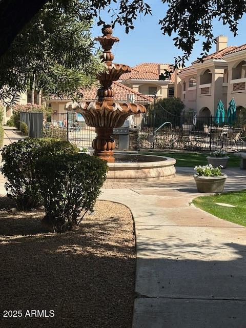 view of community featuring fence