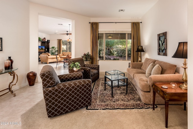 living room featuring light tile patterned floors and ceiling fan