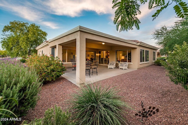 rear view of house featuring a patio area