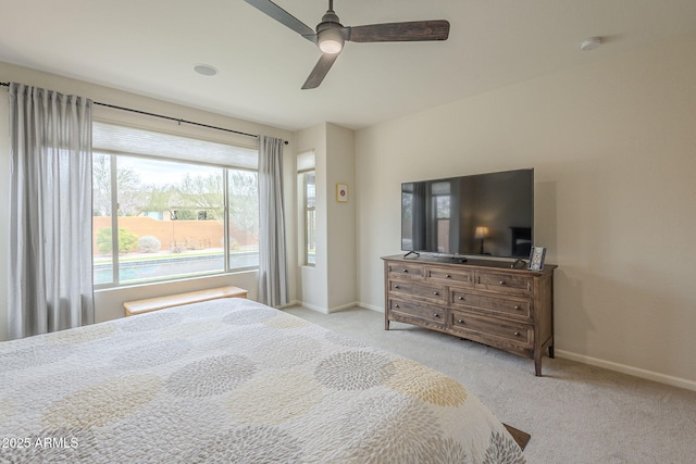 bedroom with carpet flooring, ceiling fan, and baseboards