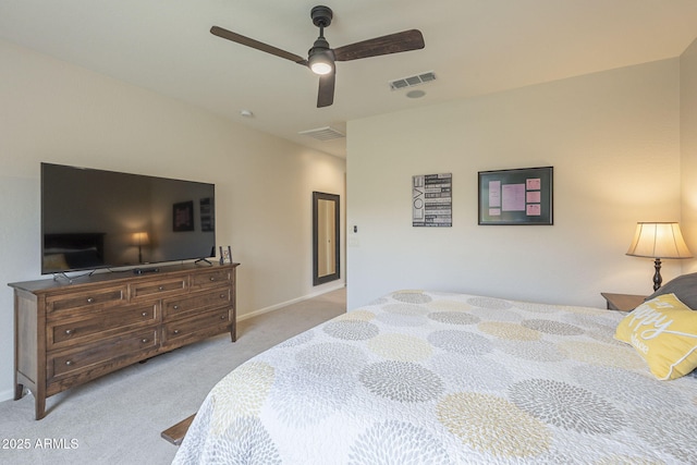 carpeted bedroom featuring ceiling fan, visible vents, and baseboards