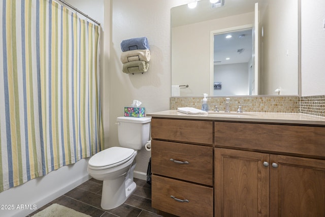 full bathroom featuring visible vents, shower / bathtub combination with curtain, backsplash, toilet, and vanity