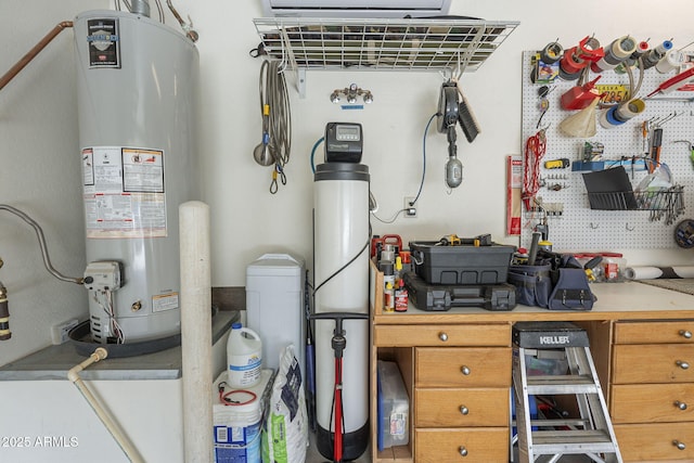 utility room with water heater