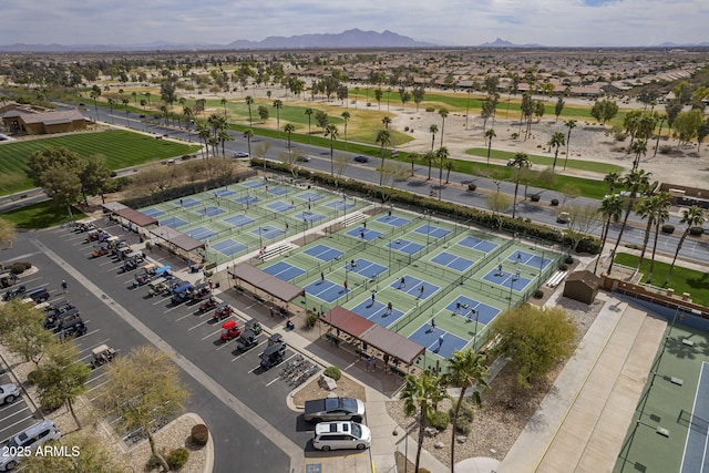 birds eye view of property with golf course view and a mountain view