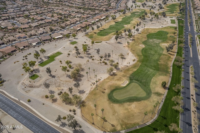 drone / aerial view with a residential view and golf course view