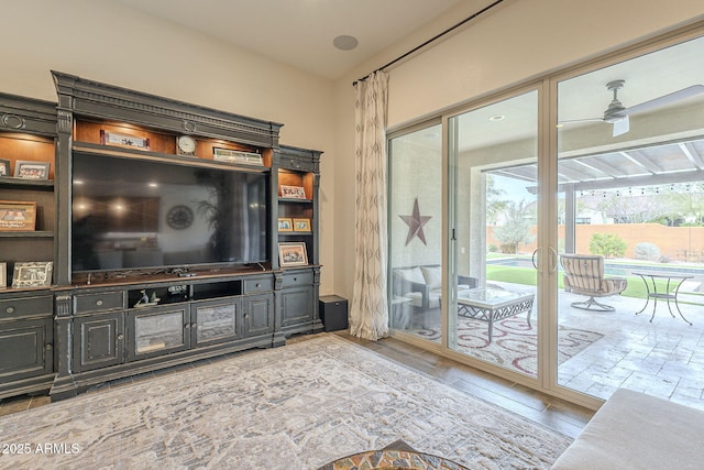 living room featuring a ceiling fan