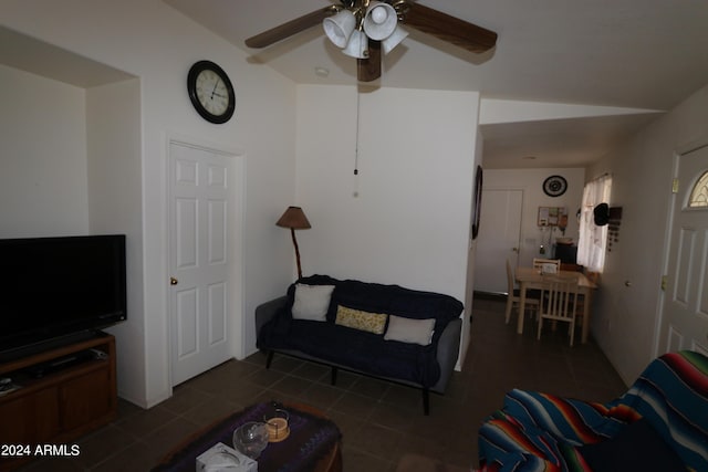 living room featuring ceiling fan and lofted ceiling