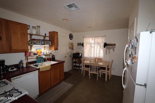 kitchen featuring sink and white appliances