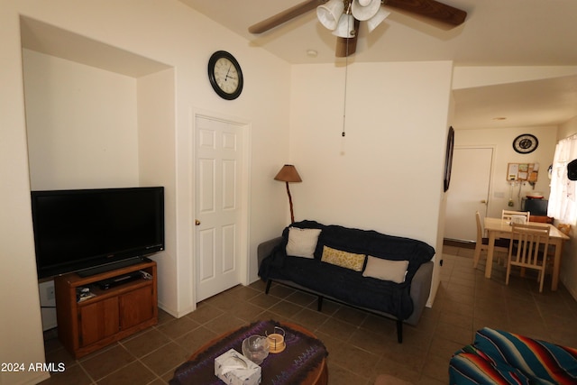 tiled living room with ceiling fan