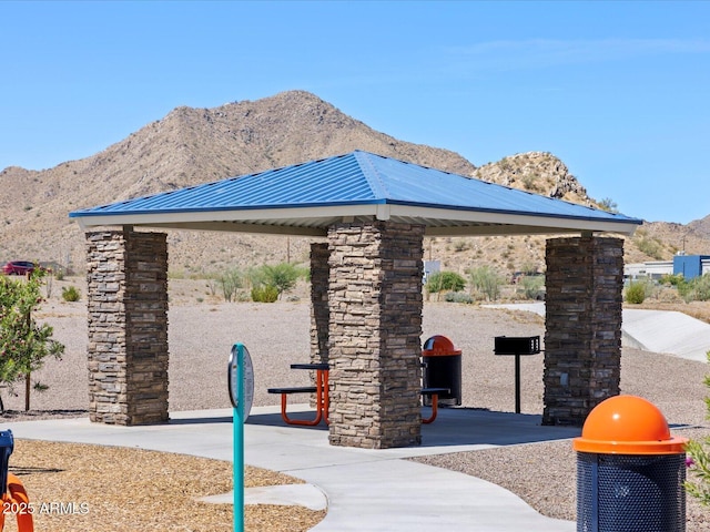 surrounding community with a gazebo and a mountain view