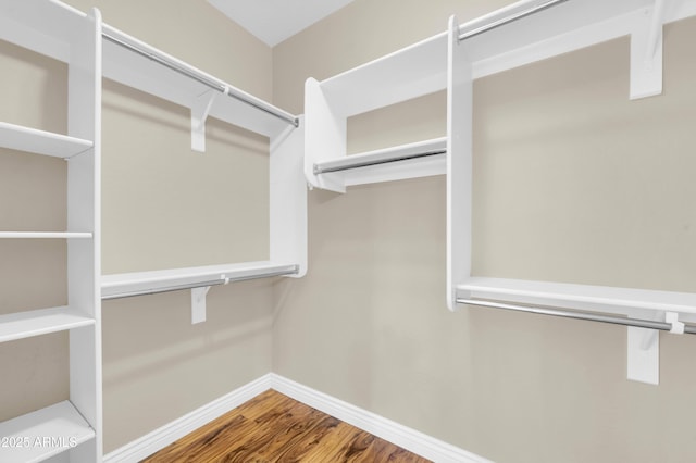 spacious closet with wood finished floors