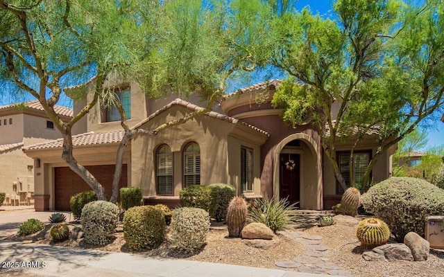 22903 N 39th Ter, Phoenix, AZ 85050 - mediterranean / spanish home with a garage, a tiled roof, stucco siding, and concrete driveway