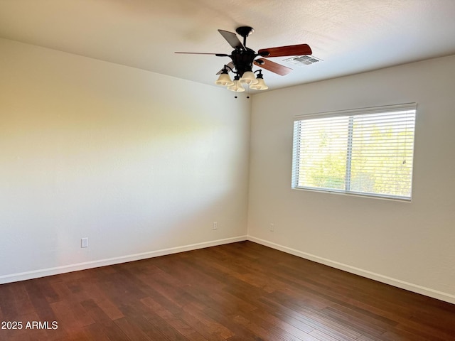 22903 N 39th Ter, Phoenix, AZ 85050 - spare room featuring dark wood finished floors and a ceiling fan