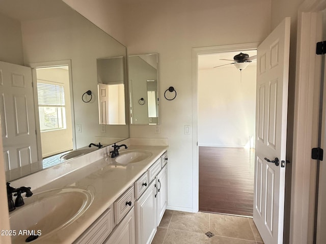22903 N 39th Ter, Phoenix, AZ 85050 - bathroom with double vanity, tile patterned floors, and ceiling fan