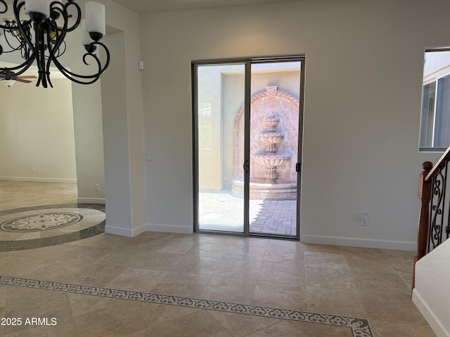 22903 N 39th Ter, Phoenix, AZ 85050 - unfurnished dining area featuring a chandelier and stone finish flooring