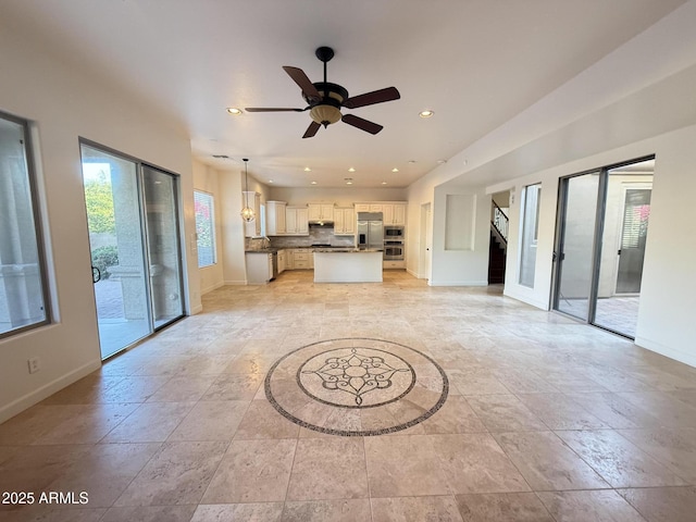 22903 N 39th Ter, Phoenix, AZ 85050 - unfurnished living room featuring ceiling fan, recessed lighting, and stairway