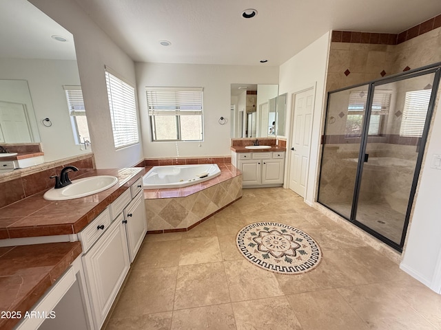 22903 N 39th Ter, Phoenix, AZ 85050 - full bath with a bath, a shower stall, two vanities, tile patterned flooring, and recessed lighting