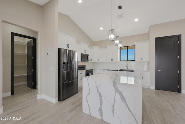 kitchen with white cabinets, stainless steel fridge with ice dispenser, a kitchen island, decorative light fixtures, and black electric range