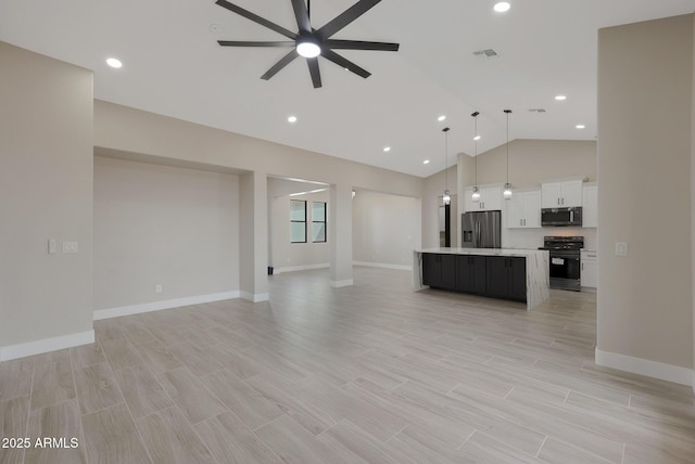 unfurnished living room with high vaulted ceiling, visible vents, baseboards, a ceiling fan, and light wood-type flooring