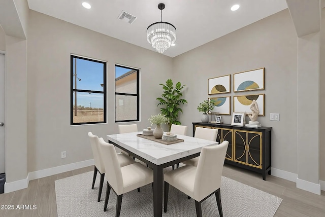 dining area with a notable chandelier, recessed lighting, visible vents, baseboards, and light wood finished floors