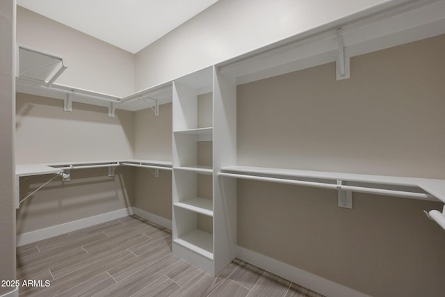 spacious closet featuring wood tiled floor