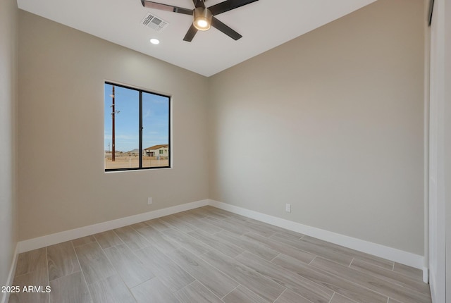 unfurnished room featuring light wood-style floors, baseboards, and a ceiling fan