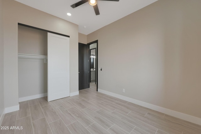 unfurnished bedroom with recessed lighting, a ceiling fan, baseboards, a closet, and wood tiled floor