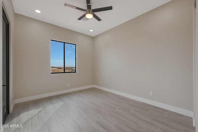 unfurnished room with a ceiling fan, recessed lighting, visible vents, and baseboards