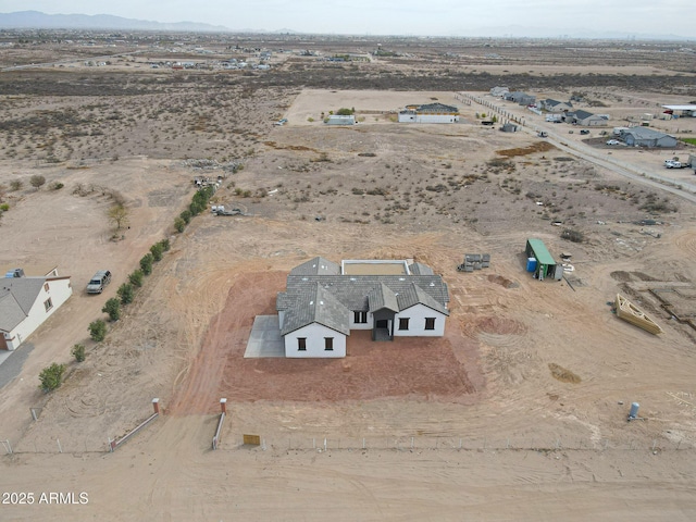 drone / aerial view featuring view of desert and a mountain view