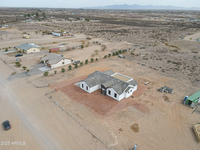 bird's eye view featuring view of desert, a rural view, and a mountain view