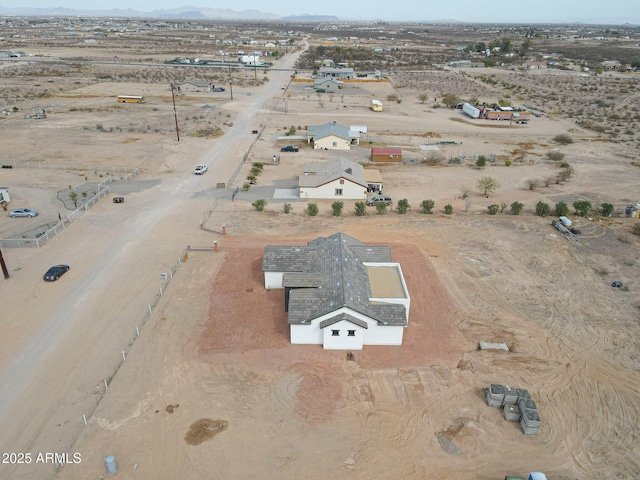 birds eye view of property featuring view of desert