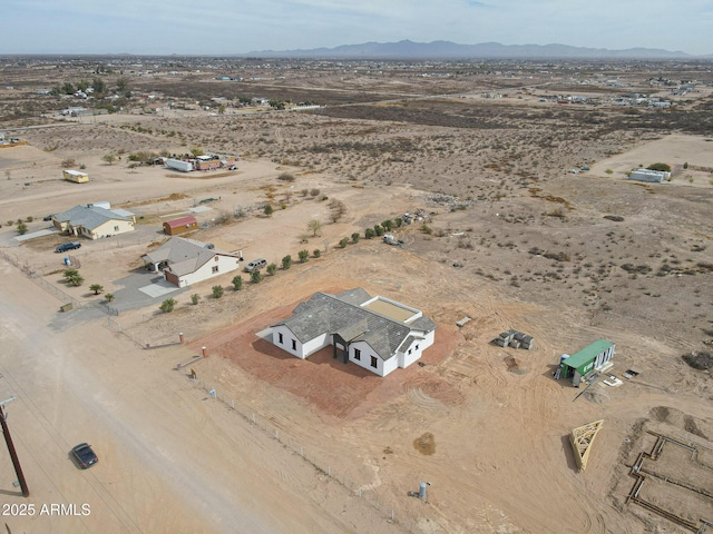 bird's eye view featuring a mountain view and view of desert