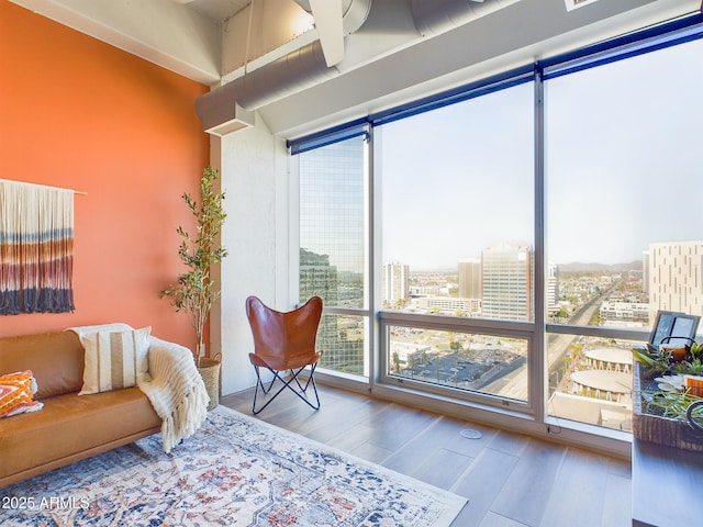 bedroom featuring multiple windows and wood-type flooring