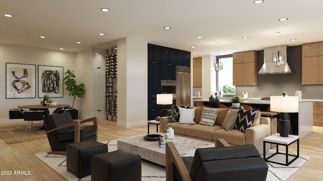 living room with a notable chandelier and light hardwood / wood-style flooring