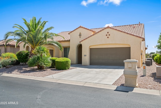 2163 N 164th Dr, Goodyear, AZ 85395 - mediterranean / spanish house featuring stucco siding, a garage, concrete driveway, and a tiled roof