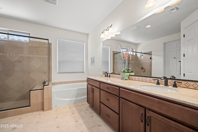 2163 N 164th Dr, Goodyear, AZ 85395 - bathroom with a bath, a shower stall, double vanity, and tile patterned floors