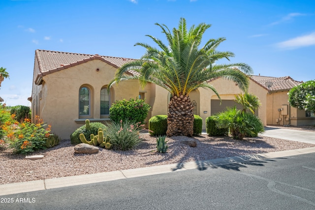 2163 N 164th Dr, Goodyear, AZ 85395 - mediterranean / spanish-style home with stucco siding, a tile roof, driveway, and a garage