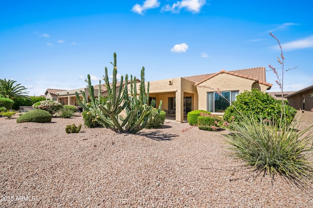2163 N 164th Dr, Goodyear, AZ 85395 - back of property featuring stucco siding and a tiled roof