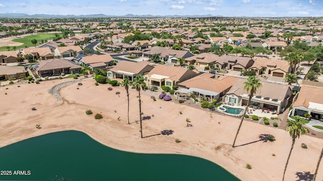 2163 N 164th Dr, Goodyear, AZ 85395 - aerial overview of property's location with nearby suburban area, a water and mountain view, and a golf course
